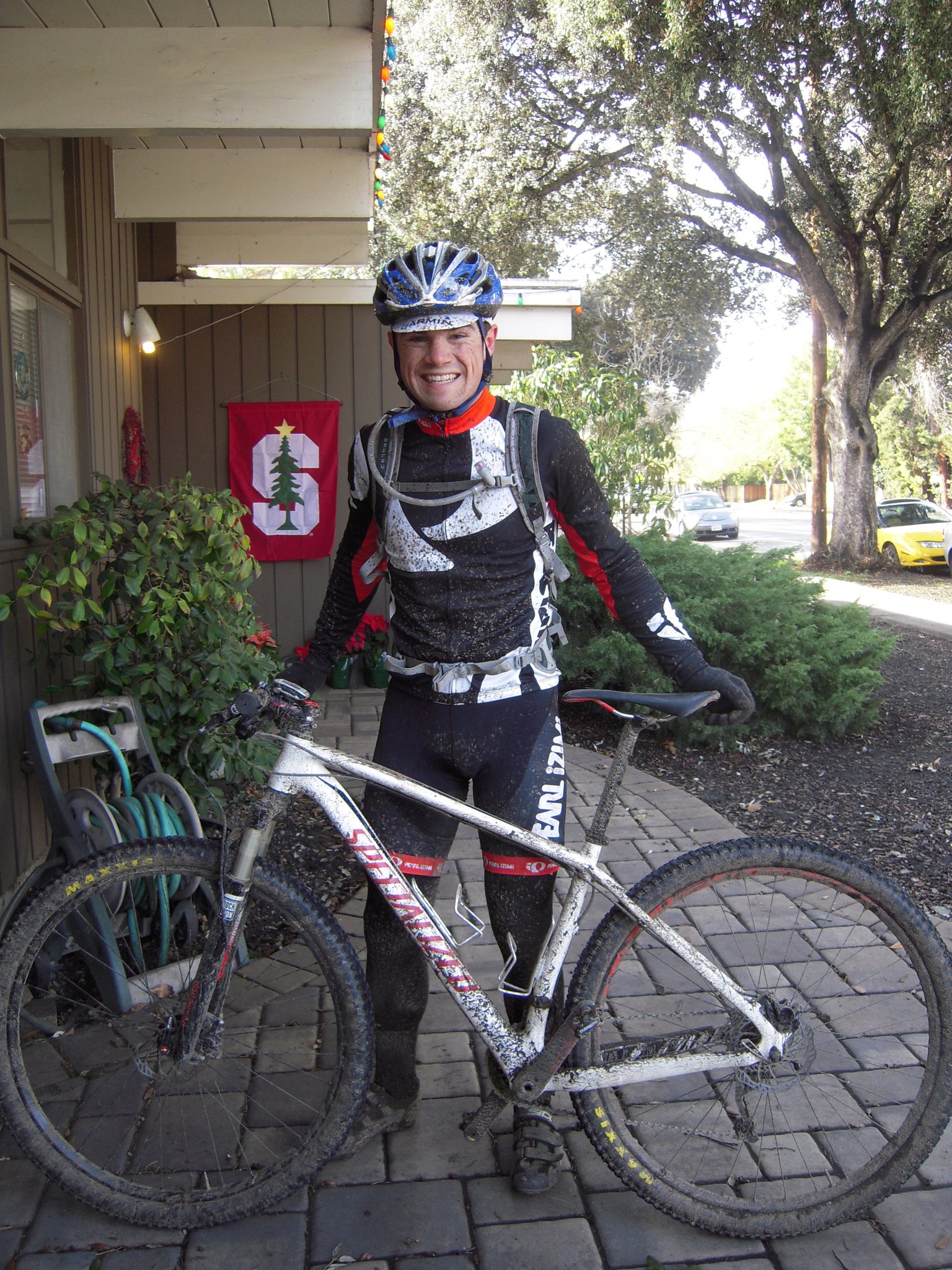 Paul covered in mud with a mountain bike