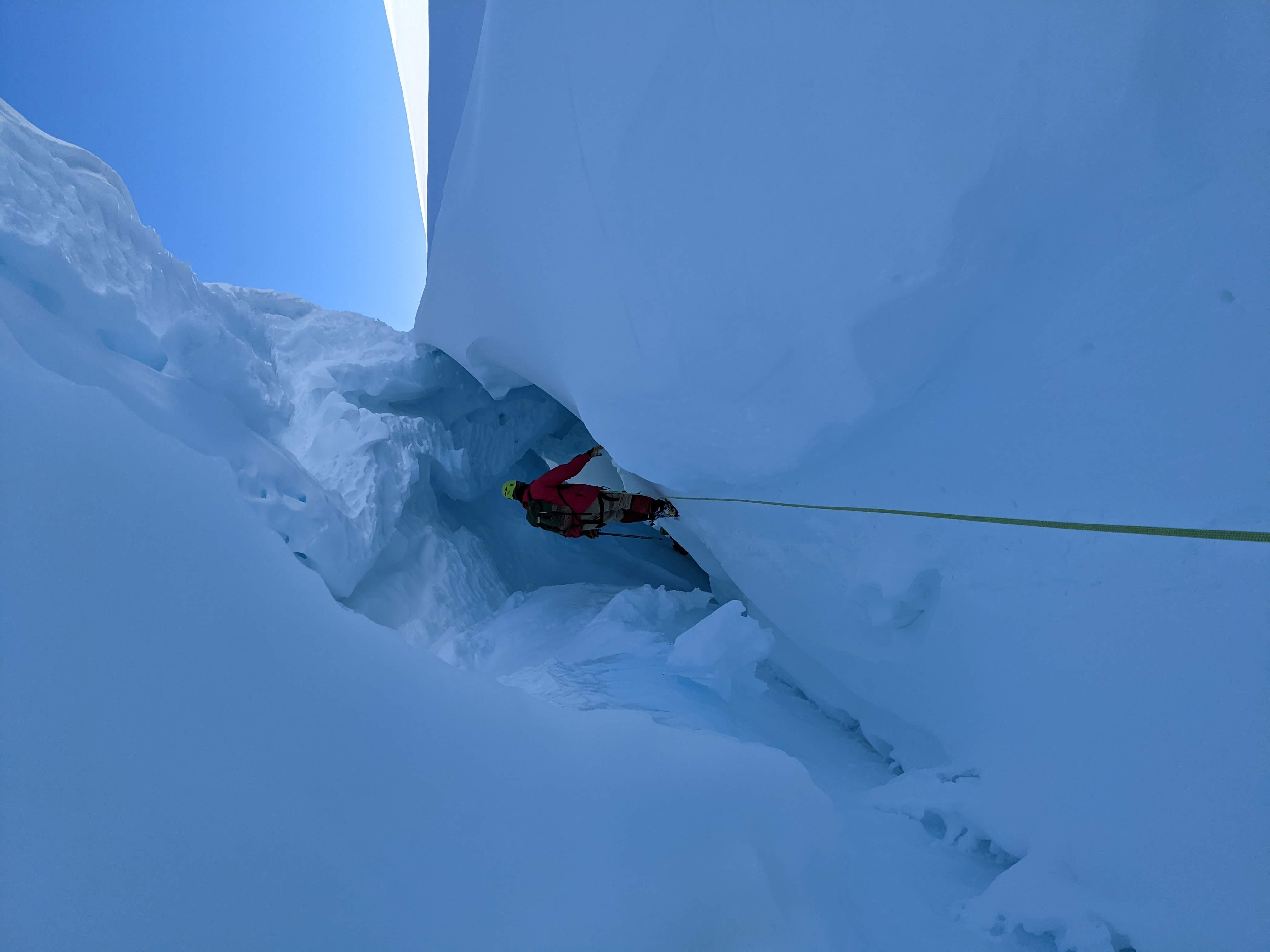 Walking down into the opening of the crevasse