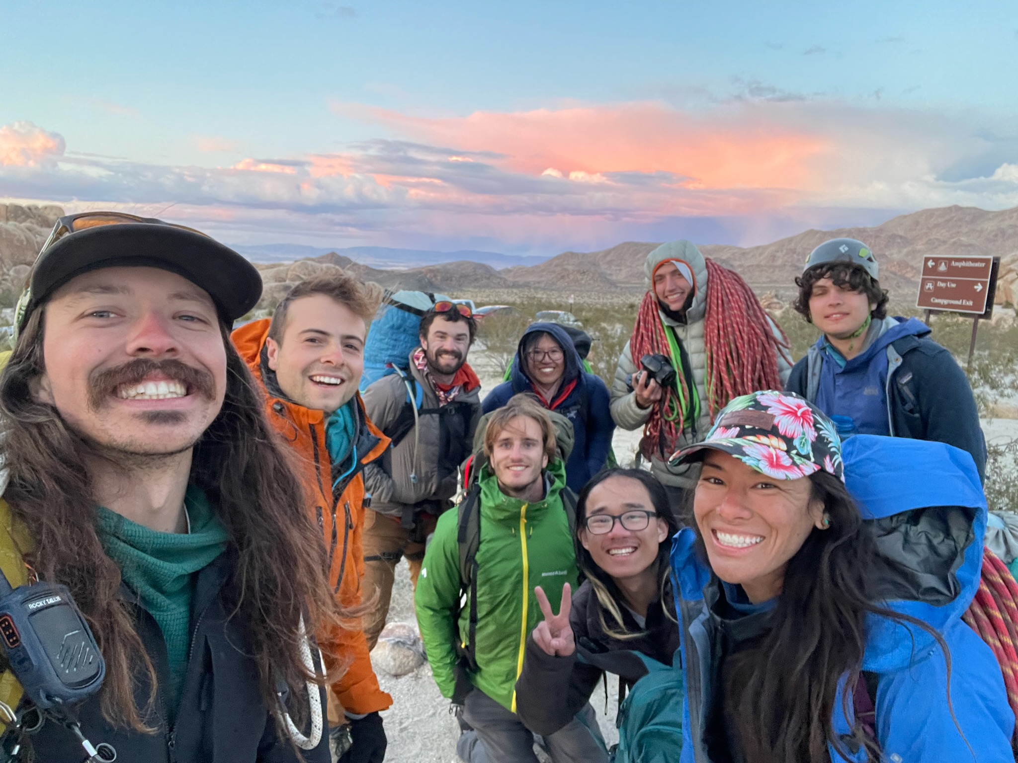 Class photo with a desert sunset