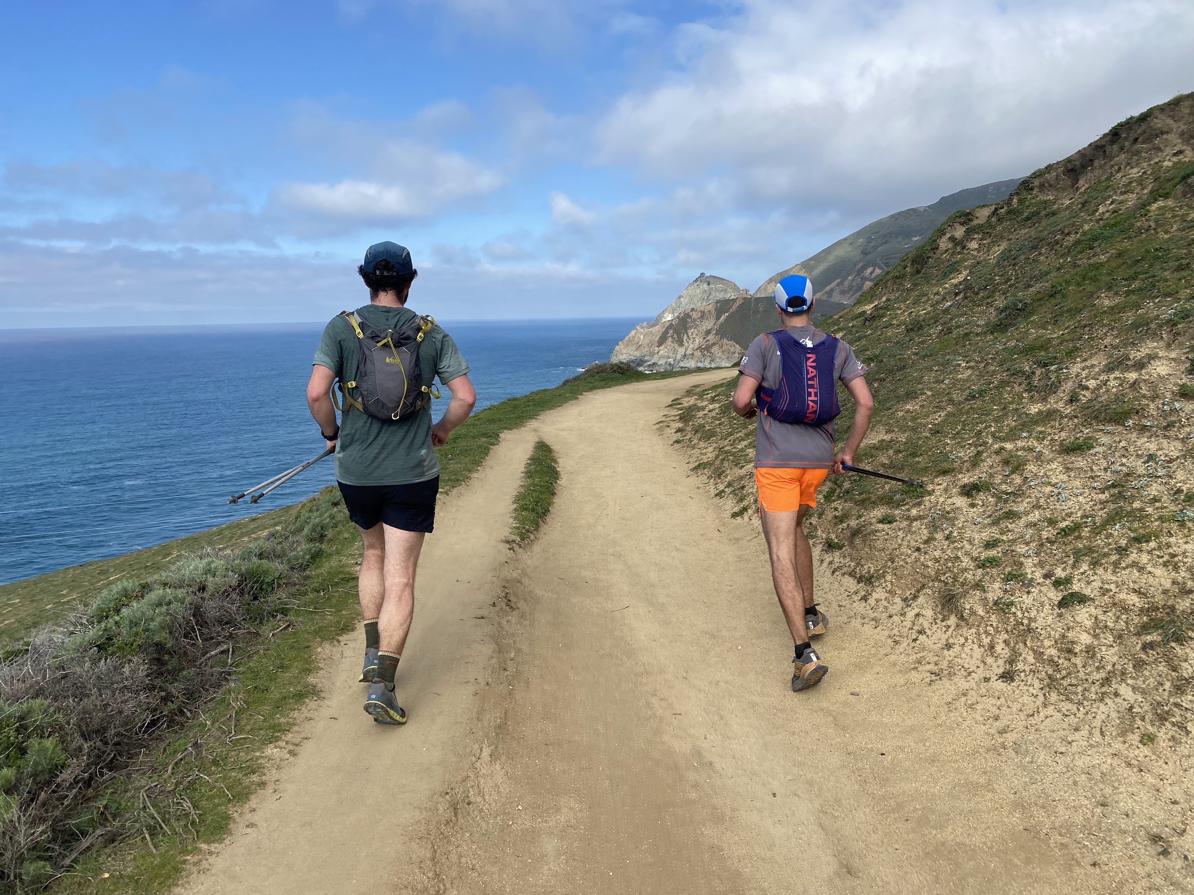 Runners on a trail over looking the ocean