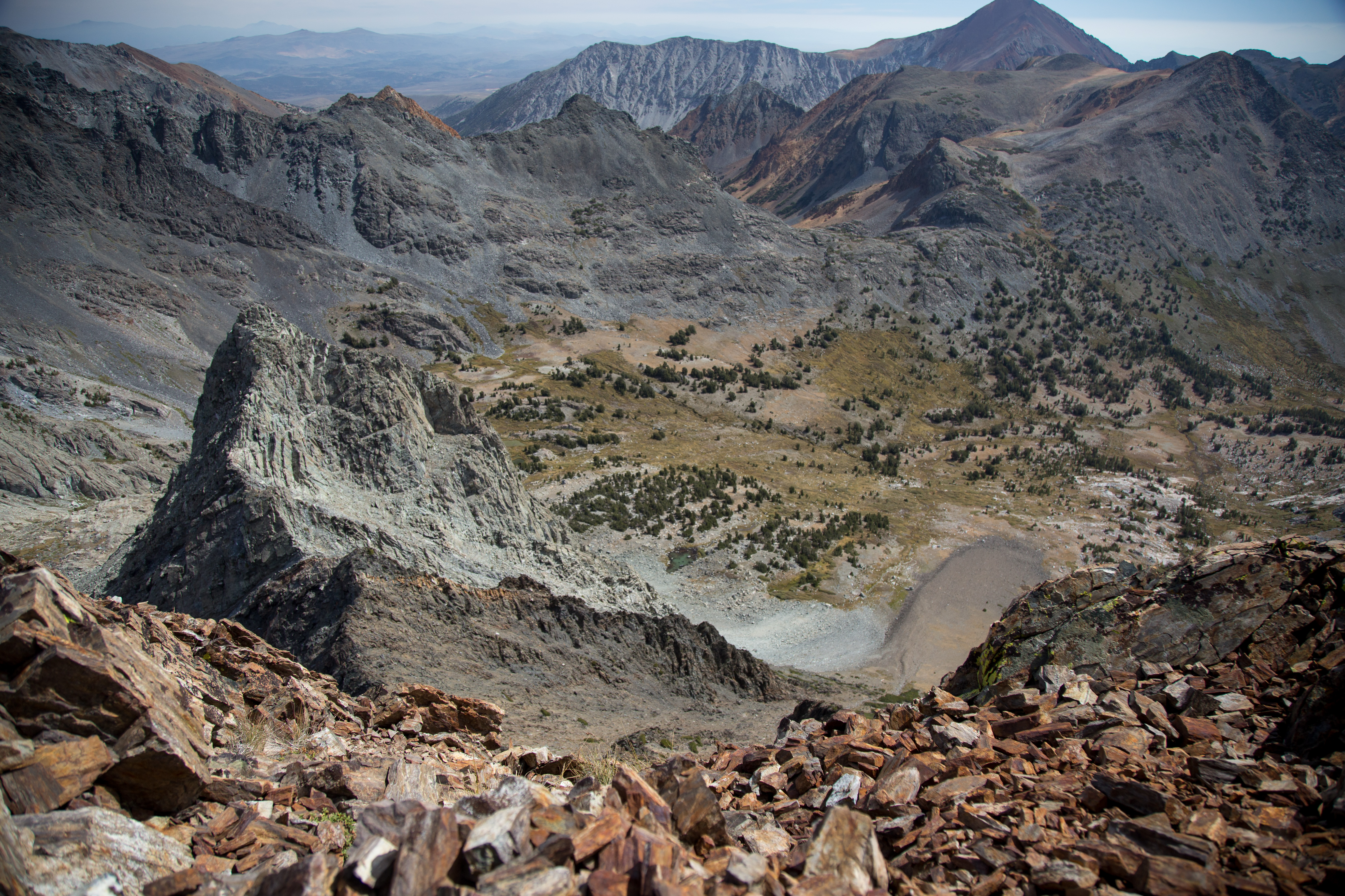 View looking down from a rocky peak