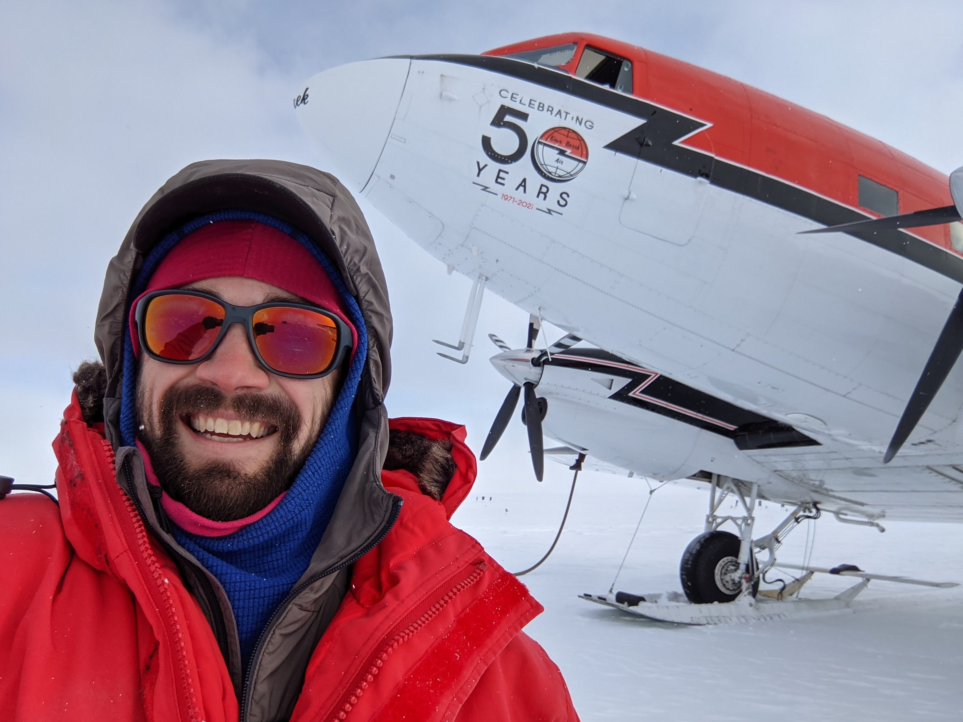 Paul in front of a Airplan on an ice sheet